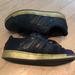 Adidas Shoes | Adidas Superstar Sneakers Black With Gold Size 2.5 | Color: Black | Size: 2.5bb