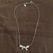 American Eagle Outfitters Jewelry | Ae Bow Costume Necklace | Color: Silver | Size: Os
