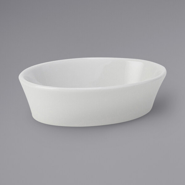 Tuxton BPK-060 7 oz. Porcelain White Oval China Baker / Casserole Dish - 12/Case
