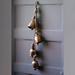 Beachcrest Home™ Wall Decor w/ 4 Bells Metal in Brown/Gray/Yellow | 36 H x 6 W x 6 D in | Wayfair 92342B404F8349529C920F825B9F6957