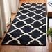 Black/White 30 x 0.63 in Area Rug - Winston Porter Cannen Geometric Handmade Tufted Wool Black Area Rug Wool | 30 W x 0.63 D in | Wayfair