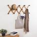 Rosalind Wheeler Amita Solid Wood 14 - Hook Wall Mounted Coat Rack Wood in Brown | Wayfair 0BE556084B164DF9AF2FF9839D7855A0