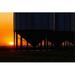 Posterazzi Silhouette of A Row of Large Metal Grain Bins with The Sunrise in The Background Poster Print by Michael Interisano - 38 x 24 - Large