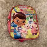 Disney Accessories | Doc Mcstuffins Small Backpack | Color: Pink/Yellow | Size: Dimensions Listed