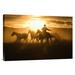 East Urban Home Oregon 'Cowboy w/ Lasso Herding Horses at Sunset' - Photograph Print on Canvas in Black/Orange | 12 H x 18 W x 1.5 D in | Wayfair