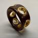 Coach Jewelry | Coach | Wooden Grommet Bangle Bracelet | Color: Brown/Gold | Size: Os