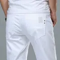 Jeans baggy en denim blanc doux pour hommes streetwear à la mode pantalons slim travail