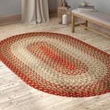 60 x 0.38 in Area Rug - August Grove® Deserie Geometric Hand Braided Warm Earth Indoor/Outdoor Area Rug | 60 W x 0.38 D in | Wayfair