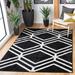 Black/White 72 x 0.44 in Indoor Area Rug - George Oliver Geometric Black/Ivory Area Rug | 72 W x 0.44 D in | Wayfair