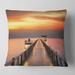 Designart 'Yellowish Sky and Long Wooden Bridge' Pier Seascape Throw Pillow