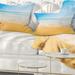 Designart 'Long Waves on Sand under Blue Sky' Seascape Throw Pillow