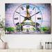 Designart 'Paris Eiffel Toweragainst Blue Sky' Cottage 3 Panels Large Wall CLock - 36 in. wide x 28 in. high - 3 panels