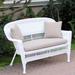 White Wicker Loveseat With Cushion and Pillows