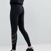 Nike Pants & Jumpsuits | Nike Gold Logo Black Jersey Leggings | Color: Black/Gold | Size: S