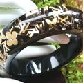 Louis Vuitton Jewelry | Hp Louis Vuitton Elegant Inclusion Shiny Black Gold Bangle Resin Lv Bracelet Ln | Color: Black/Gold | Size: Large 7 1/2" Round