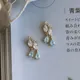 Boucles d'oreilles à pompon en forme de goutte cristal blanc incrusté d'argent créatif unique du