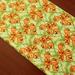 The Holiday Aisle® 8_Spooky Pumpkins Halloween Table Runner Cotton in Green | 60 W x 12 D in | Wayfair 48BD2E817F0644F585838481644513D7