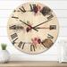 Designart 'Ethnic Feathers and Flowers On Native Arrows III' Bohemian & Eclectic Wood Wall Clock