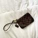 Coach Bags | Coach Corner Zip Wristlet In Signature Dark Brown Canvas W/Embossed Logo Tag | Color: Brown | Size: Os