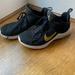 Nike Shoes | Black And Gold Nike Shoe Woman’s Size 8 | Color: Black/Gold | Size: 8
