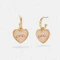 Coach Jewelry | Coach Signature Heart Huggie Earrings | Color: Gold/Pink | Size: 1/2" (L) X 1" (H)