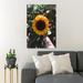 Gracie Oaks Person Holding Yellow Sunflower During Daytime - 1 Piece Rectangle Graphic Art Print On Wrapped Canvas in Black/Green/Yellow | Wayfair