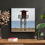 Highland Dunes Brown Wooden Lifeguard Tower On Beach During Daytime - 1 Piece Square Graphic Art Print On Wrapped Canvas Metal | Wayfair