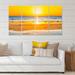 East Urban Home Sunset on Beautiful Sand Beach w/ Blue Sea Water - 4 Piece Wrapped Canvas Photograph Canvas in Blue/Yellow | Wayfair