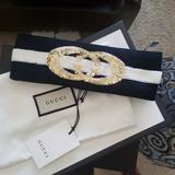 Gucci Accessories | Gucci Black And White Headband With Interlocking Gucci Gg Logo In Gold Sequins | Color: Black/White | Size: Os