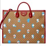 Gucci Bags | Gucci X Doraemon Leather-Trimmed Printed Monogrammed Coated-Canvas Tote Bag Nwt | Color: Brown | Size: Large