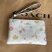 Coach Bags | Coach Mystical Floral Print Corner Zip Wristlet In Signature Canvas Gold / Chalk | Color: Cream/White | Size: Small