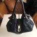 Dooney & Bourke Bags | Dooney & Bourke Black Belvedere Logo Locktop Shoulder Bag | Color: Black | Size: Os