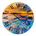 Designart 'Orange Sunset Over Whirly Blue Waves' Nautical & Coastal wall clock