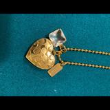 Coach Jewelry | Brand New Coach Locket Pendant. | Color: Gold | Size: Os