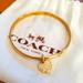 Coach Jewelry | Coach Bangle Bracelet With Heart Pendant - *Rare* | Color: Gold | Size: Os