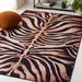 Black/Brown 96 x 60 x 0.25 in Indoor Area Rug - Everly Quinn Animal Print Power Loom Polyester Area Rug in Light Orange/Black Polyester | Wayfair