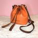 Dooney & Bourke Bags | Dooney And Burke Orange Leather Drawstring Crossbody Bucket Bag Coin Purse | Color: Orange | Size: Os