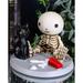 Trinx Deniah Lucky the Skeleton Boy Sitting by Spilled Milk & Cat Figurine Resin in Black/Yellow | 2.5 H x 3.25 W x 3.25 D in | Wayfair