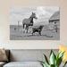 East Urban Home 1950s-1960s Black Dog Leading Horse by Holding Rope Halter in His Mouth by Vintage Images | 18 H x 26 W x 1.5 D in | Wayfair