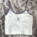 Brandy Melville Tops | Brandy Melville Skylar Embroidered Flower Boy White Tank Top | Color: Blue/White | Size: Xs