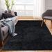 Black 96 x 60 x 1.2 in Area Rug - Ebern Designs Virtus Solid Color Machine Made Handwoven Polypropylene Area Rug | 96 H x 60 W x 1.2 D in | Wayfair