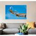East Urban Home 'A North American P-51D Mustang' Photographic Print on Canvas Canvas/Metal in Blue/Orange | 40 H x 60 W x 1.5 D in | Wayfair