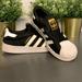 Adidas Shoes | Adidas Size 2.5 Black And White Sneaker | Color: Black/White | Size: 2.5bb