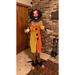 The Holiday Aisle® Standing Animated Clown Figurine Polyester in Black/Orange/Yellow | 69 H x 20 W x 3 D in | Wayfair