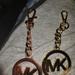 Michael Kors Other | Michael Kors Charms One Gold And One Rose Gold | Color: Gold | Size: Os
