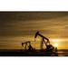 Silhouette of Two Pump Jacks At Sunrise with Sun Burst & Colourful Clouds in The Sky - Alberta Canada Poster Print by Michael Interisano 19 x 12