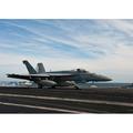 An F/A-18F Super Hornet takes off from the flight deck of USS Enterprise Poster Print by Stocktrek Images (34 x 22)