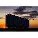 Silhouette of A Row of Large Metal Grain Bins with The Sunrise in The Background Poster Print by Michael Interisano 38 x 24 - Large