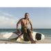 A Man Sits On His Surfboard On The Beach; Tarifa Cadiz Andalusia Spain Poster Print (36 x 26)