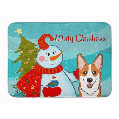 The Holiday Aisle® Dori Snowman w/ Red Corgi Bath Rug Microfiber in Green/Blue | 27 H x 19 W in | Wayfair F6824840EA8340468655E1FD3CB9C035